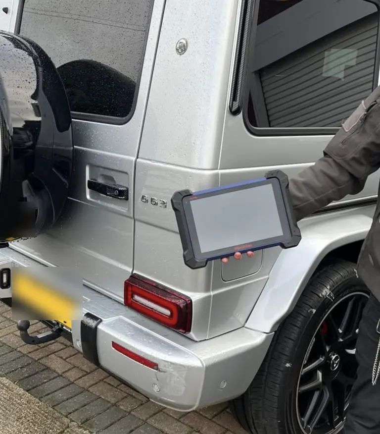 Diagnostic tablet connected to a Mercedes G-Class