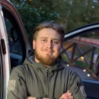 Ion, the car locksmith at Master Key Automotive, standing by his van